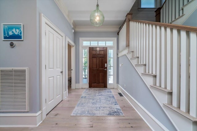 764 Post Oak Dr, Mount Pleasant, SC 29464 - foyer entrance featuring ornamental molding, baseboards, stairway, and wood finished floors