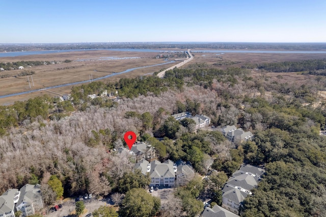 birds eye view of property featuring a forest view