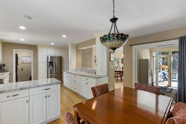 2653 Seabrook Island Rd, Seabrook Island, SC 29455 - dining space with light wood-style flooring, recessed lighting, and decorative columns