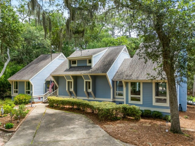 2653 Seabrook Island Rd, Seabrook Island, SC 29455 - view of front of home with a shingled roof and a porch