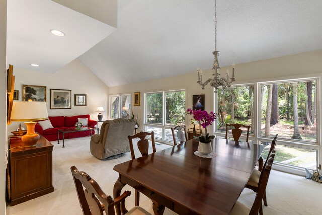 2653 Seabrook Island Rd, Seabrook Island, SC 29455 - dining area with light colored carpet, vaulted ceiling, a chandelier, and recessed lighting
