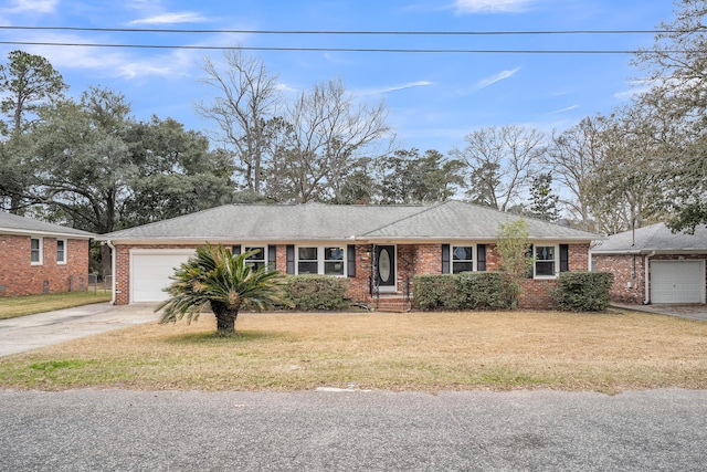 ranch-style house with a garage and a front yard