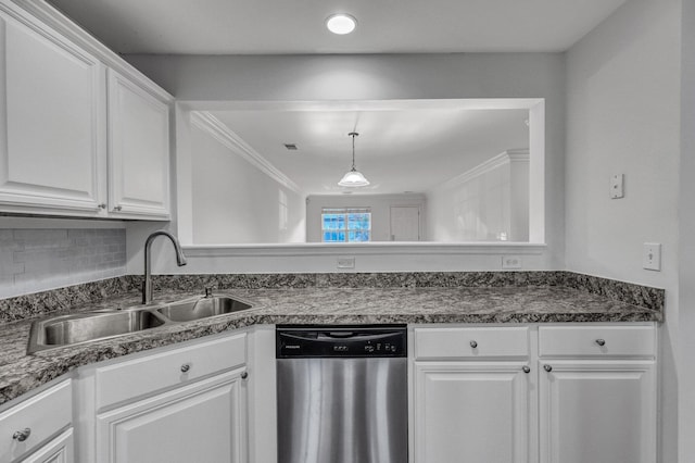 kitchen featuring a sink, white cabinetry, ornamental molding, stainless steel dishwasher, and dark countertops