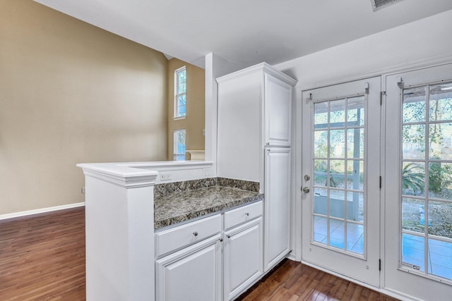 entryway featuring dark wood-style floors and baseboards