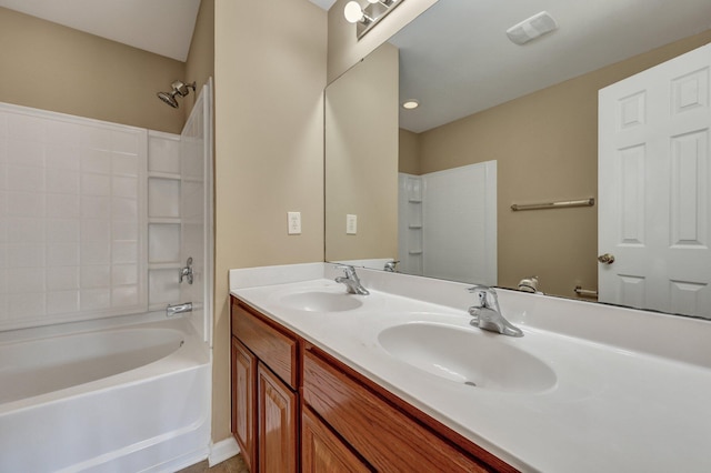 bathroom featuring shower / bath combination, a sink, and double vanity