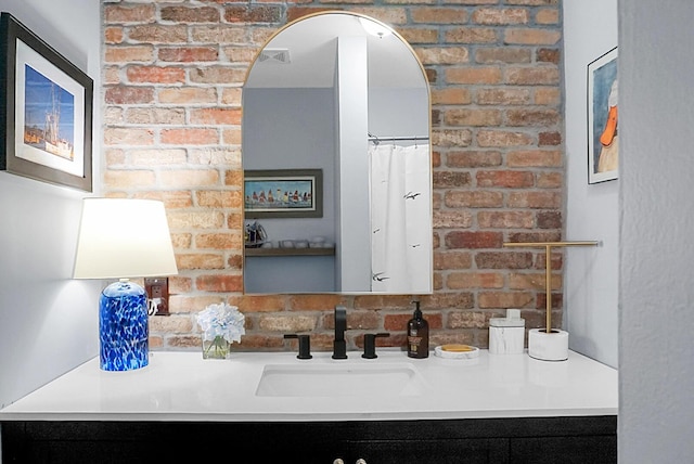 7886 Racquet Rd, North Charleston, SC 29418 - bathroom view of vanity and brick wall