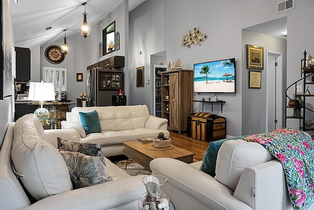 7886 Racquet Rd, North Charleston, SC 29418 - living area featuring high vaulted ceiling and wood finished floors