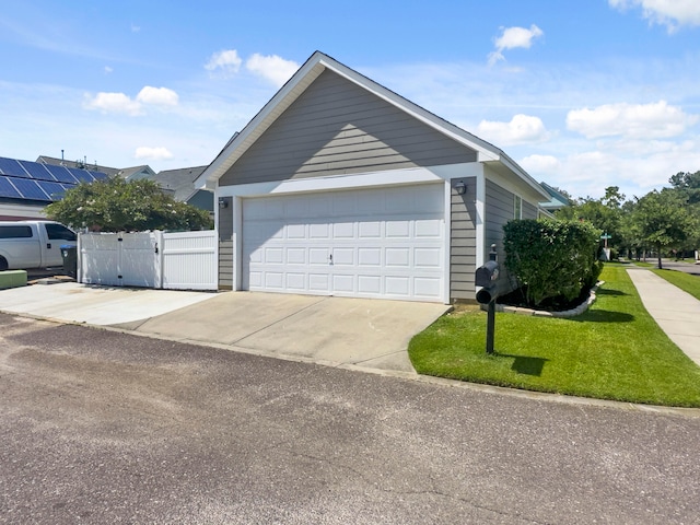 view of property exterior with a garage and solar panels