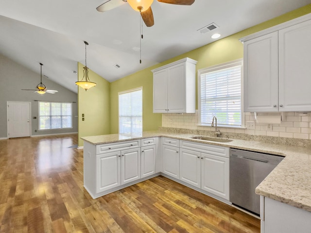 kitchen with light hardwood / wood-style flooring, sink, backsplash, dishwasher, and ceiling fan