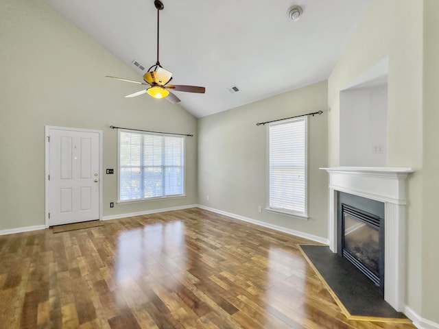 unfurnished living room featuring high vaulted ceiling, ceiling fan, and hardwood / wood-style floors