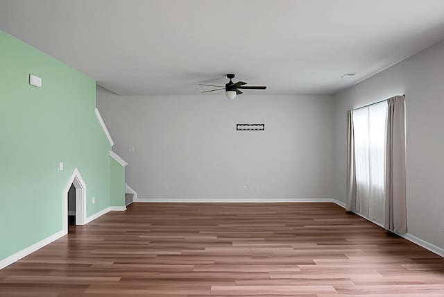 717 Butter Rd, Bonneau, SC 29431 - unfurnished living room with ceiling fan, wood finished floors, and stairs