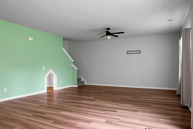 717 Butter Rd, Bonneau, SC 29431 - unfurnished living room featuring wood finished floors, ceiling fan, and stairway