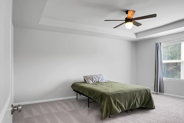 717 Butter Rd, Bonneau, SC 29431 - bedroom with a tray ceiling, light colored carpet, and a ceiling fan