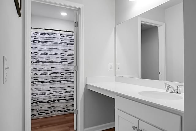 717 Butter Rd, Bonneau, SC 29431 - full bath with vanity, wood finished floors, and a shower with shower curtain