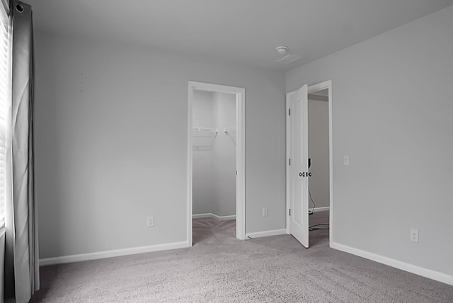 717 Butter Rd, Bonneau, SC 29431 - unfurnished bedroom featuring a spacious closet, carpet flooring, and a closet