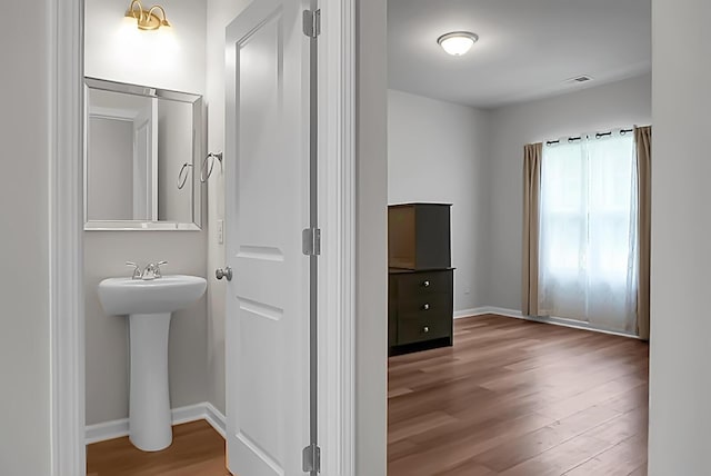 717 Butter Rd, Bonneau, SC 29431 - bathroom featuring wood finished floors and baseboards