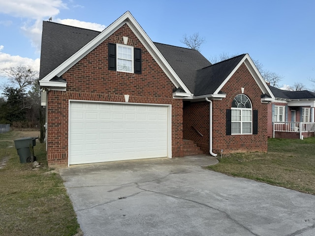 view of front property with a garage and a front lawn