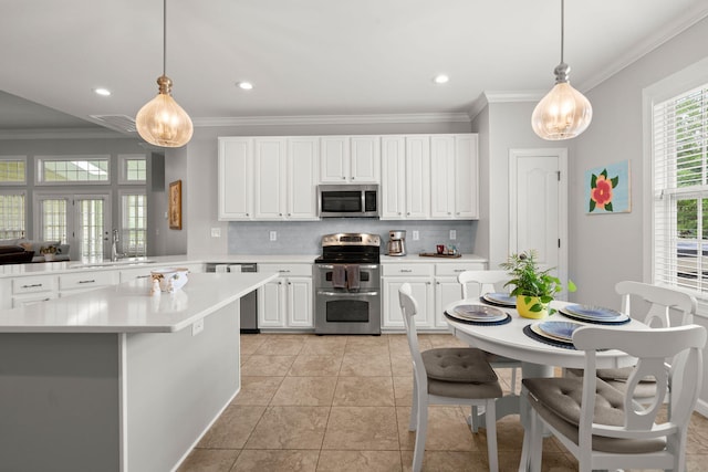 2772 Latrobe Ct, Mount Pleasant, SC 29466 - kitchen with stainless steel appliances, decorative backsplash, light countertops, ornamental molding, and a sink