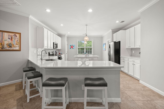 2772 Latrobe Ct, Mount Pleasant, SC 29466 - kitchen featuring appliances with stainless steel finishes, a sink, a peninsula, decorative backsplash, and ornamental molding
