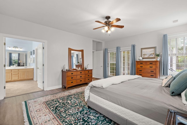 2772 Latrobe Ct, Mount Pleasant, SC 29466 - bedroom featuring light wood-style flooring, a ceiling fan, ensuite bathroom, and baseboards