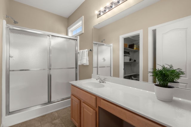 2772 Latrobe Ct, Mount Pleasant, SC 29466 - bathroom featuring a stall shower, vanity, and a walk in closet