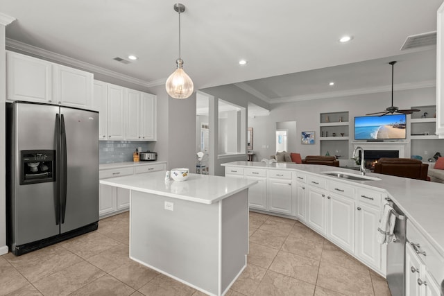 2772 Latrobe Ct, Mount Pleasant, SC 29466 - kitchen featuring stainless steel refrigerator with ice dispenser, a sink, open floor plan, ornamental molding, and light countertops