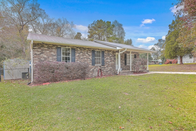 ranch-style home with a front lawn