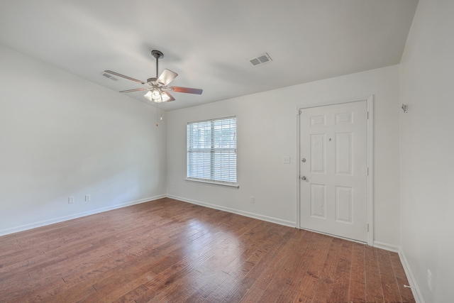 unfurnished room with ceiling fan and hardwood / wood-style flooring