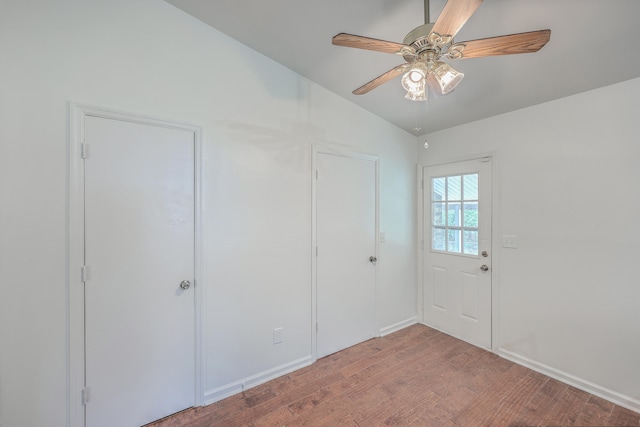 interior space with hardwood / wood-style floors, ceiling fan, and lofted ceiling