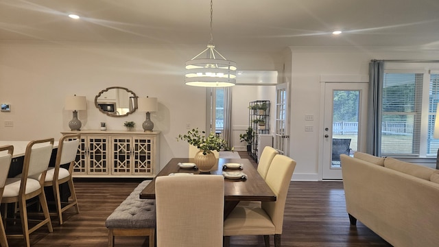 dining area with recessed lighting, dark wood-style floors, and crown molding