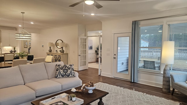 living area with dark wood finished floors, recessed lighting, baseboards, and a ceiling fan