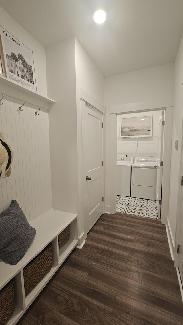 mudroom featuring separate washer and dryer and wood finished floors