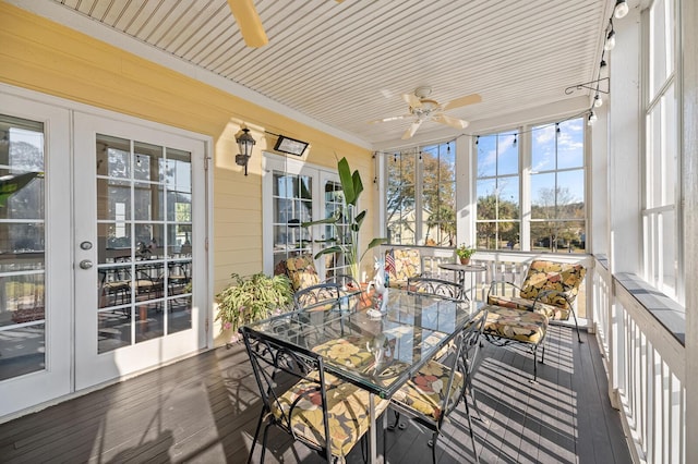 sunroom with a ceiling fan and french doors