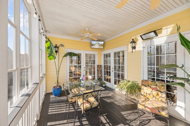 sunroom featuring french doors and ceiling fan