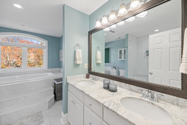 full bathroom featuring double vanity, a sink, marble finish floor, and a bath