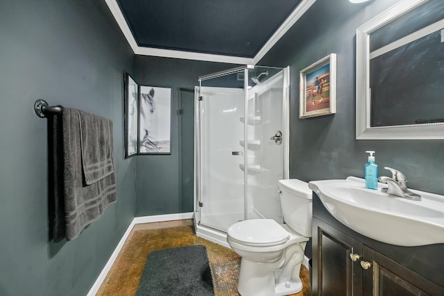 full bath with toilet, vanity, baseboards, a stall shower, and crown molding