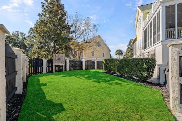 view of yard with a fenced backyard