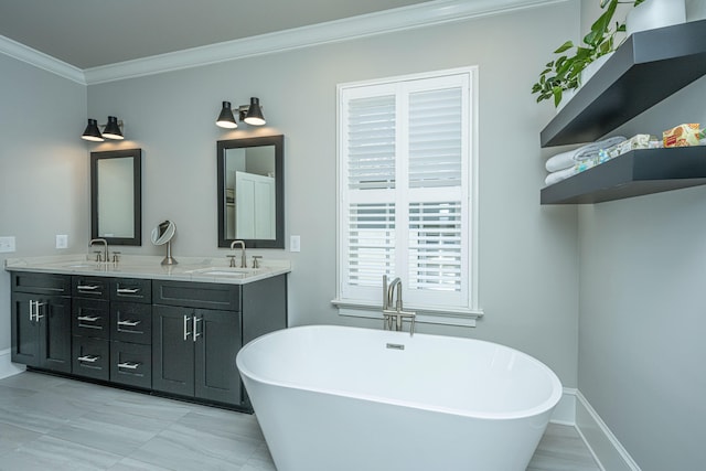 full bath with double vanity, a soaking tub, ornamental molding, and a sink