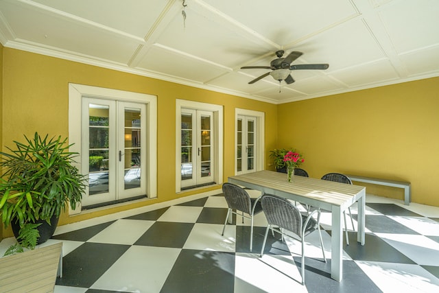 sunroom featuring french doors and ceiling fan