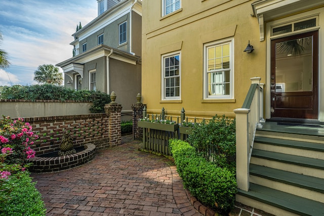 property entrance with stucco siding