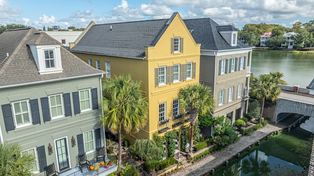 exterior space with a water view and a residential view