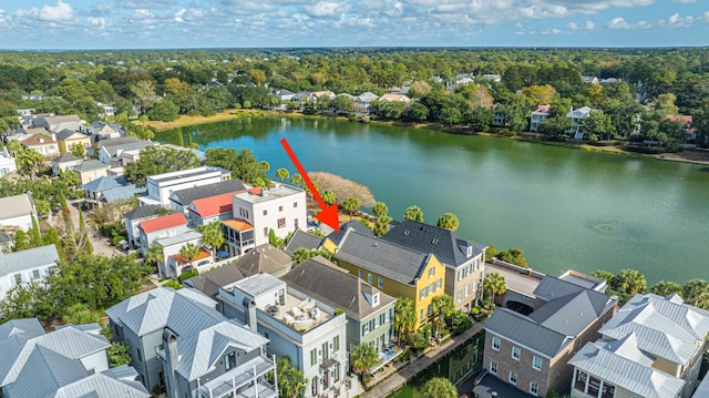 drone / aerial view with a water view and a residential view