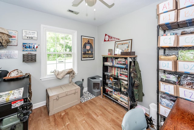 misc room featuring baseboards, ceiling fan, visible vents, and wood finished floors