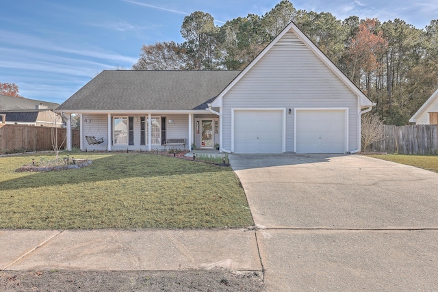 ranch-style house featuring a garage, a front lawn, and covered porch