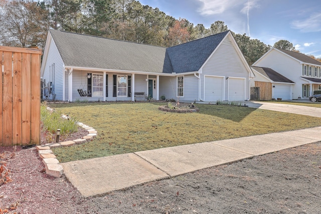 view of front of property with a garage, covered porch, and a front yard