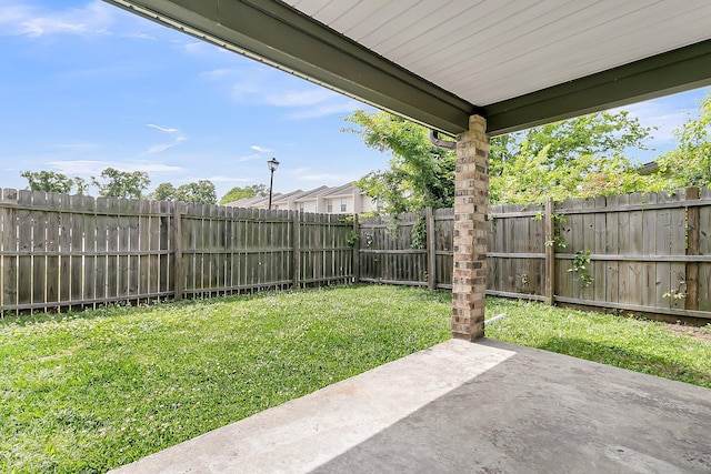 view of yard with a fenced backyard and a patio area
