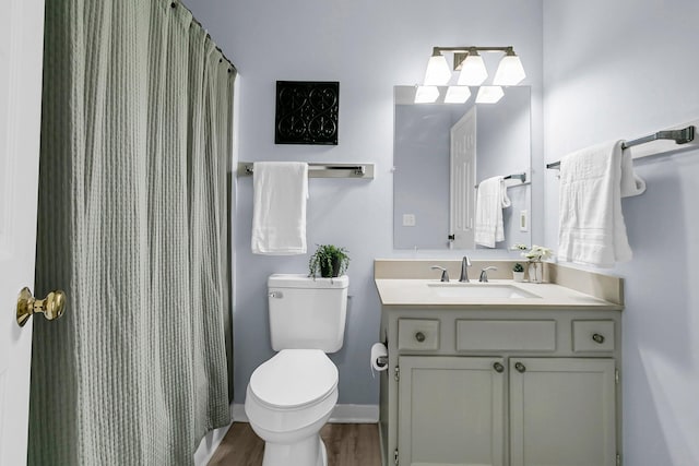 full bathroom with wood finished floors, vanity, baseboards, toilet, and a shower with shower curtain