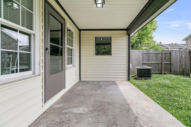 view of patio with fence and central AC