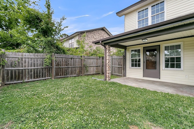 view of yard with a patio and a fenced backyard