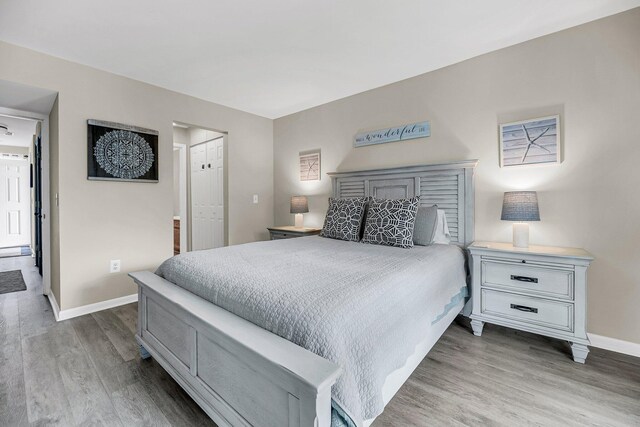 bedroom featuring hardwood / wood-style flooring and a closet